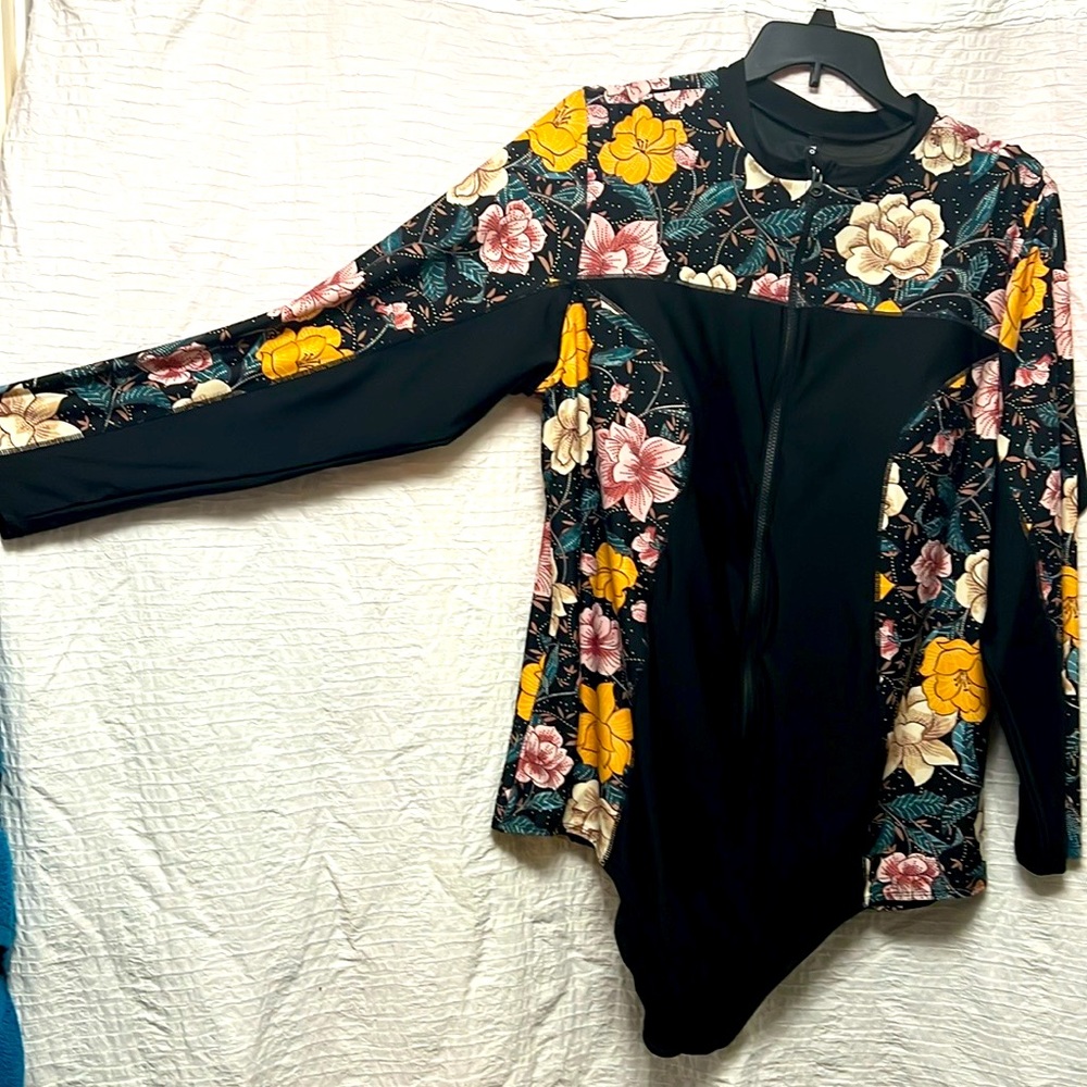 Rash Guard Swimsuit 35” long, 25” wide, sleeves are 25” long and 12” wide NWOT